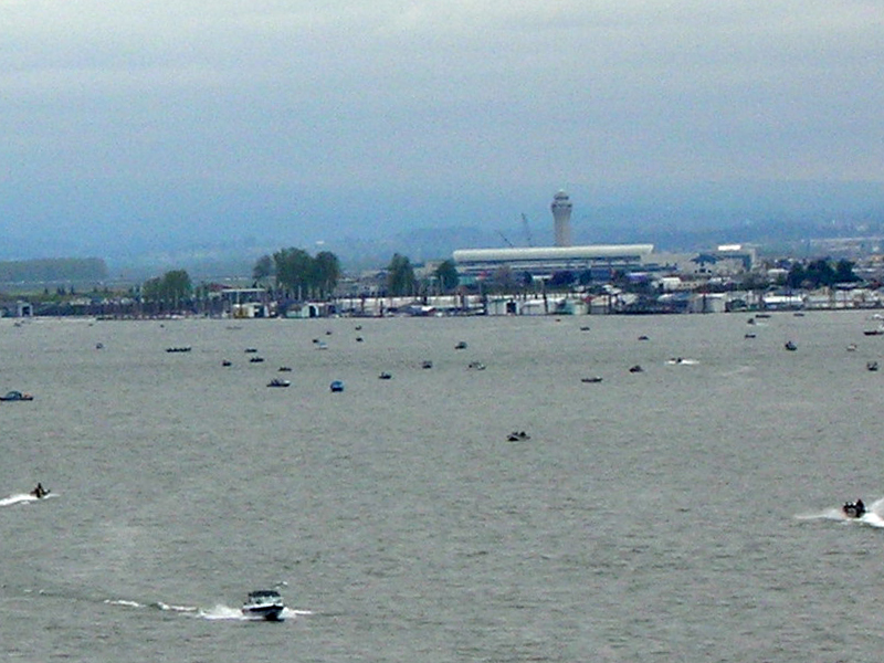 Boats in river near airport