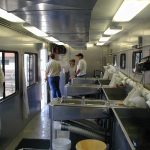 interior of trailer showing stainless steel fish holding areas